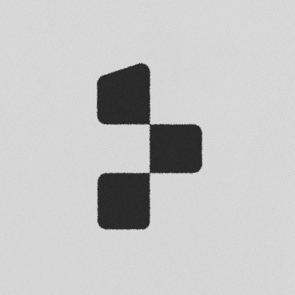 The checkered trabbey element: three rounded blocks forming a stylised t